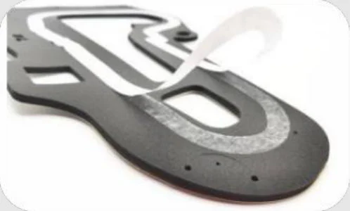 PVC foam part with a partial adhesive liner peeling back
